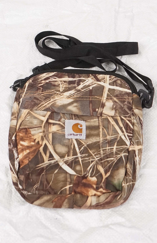 Camouflage crossbody bag with Carhartt logo on a white background