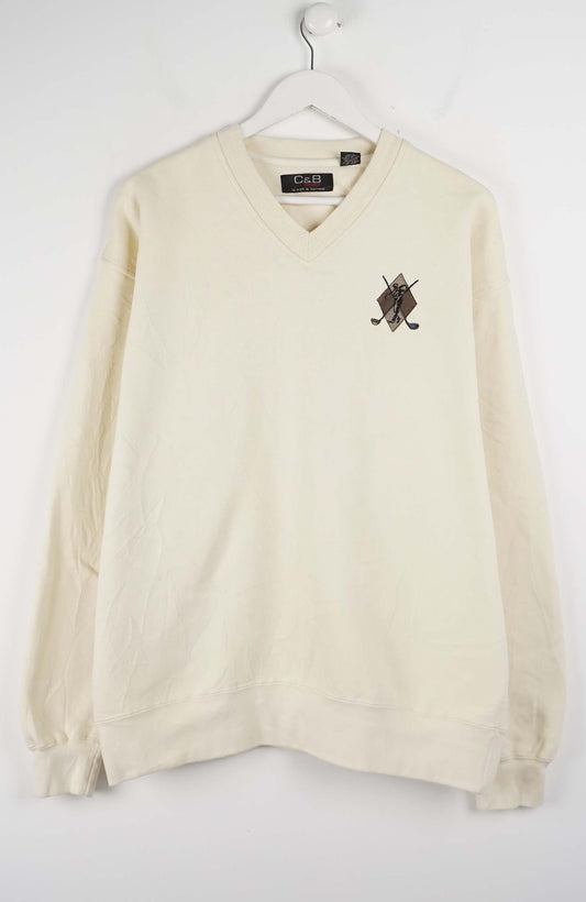 Beige sweater with a logo on a white background