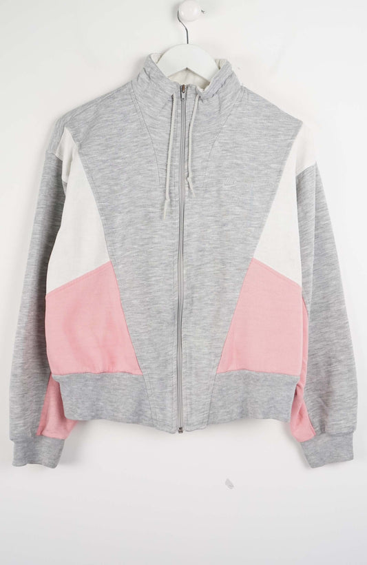 Gray and pink color-blocked zip-up hoodie on a white background