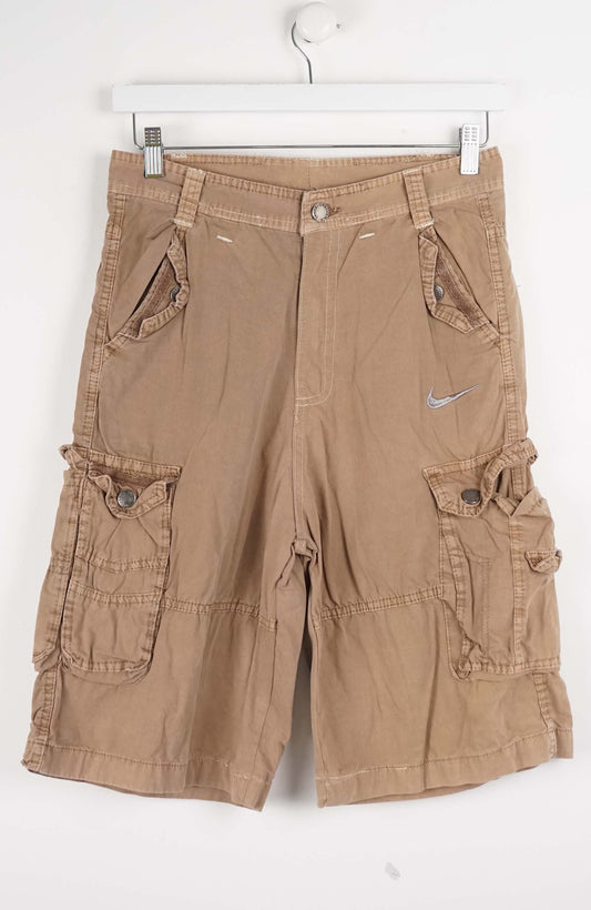 Brown cargo shorts with a Nike logo on a white background