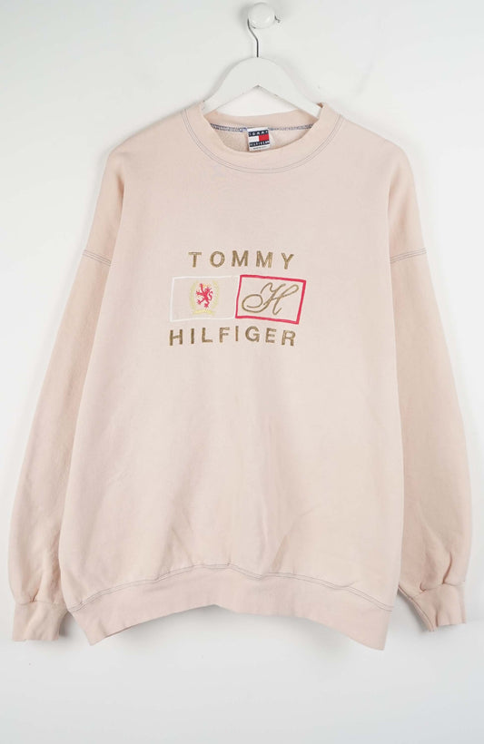 Pink Tommy Hilfiger sweatshirt on a white background