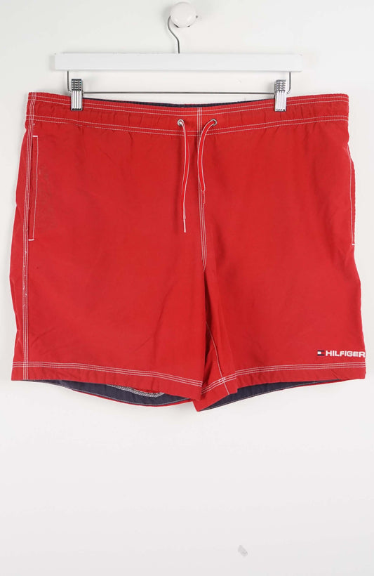 Red shorts with a brand logo on a white background