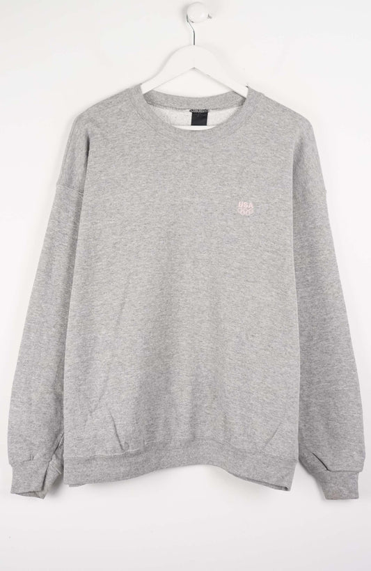Gray sweatshirt with a small pink logo on a white background