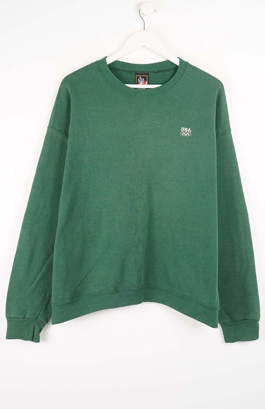 Green sweatshirt with a small logo on a white background